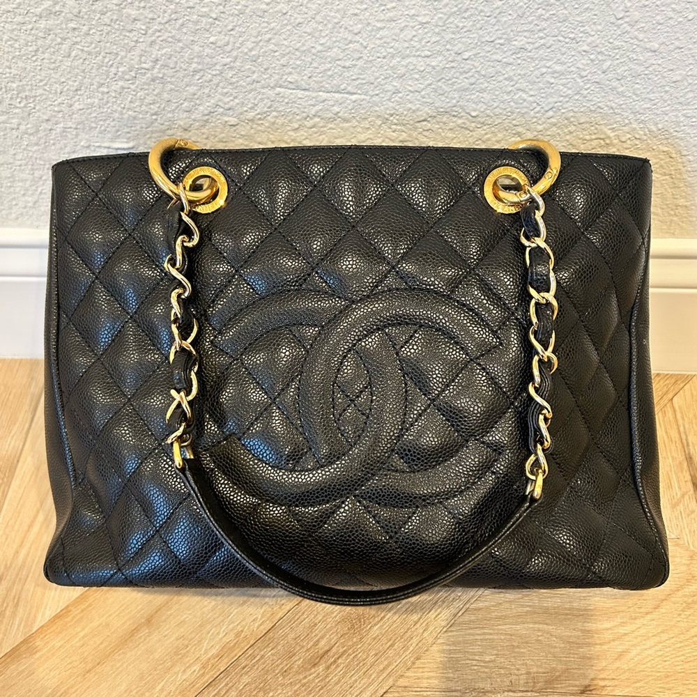 Iconic CHANEL Grand Shopping Tote in black caviar leather with gold hardware